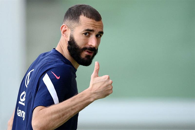 In this file photo taken on October 8, 2021, France s forward Karim Benzema reacts after a training 
