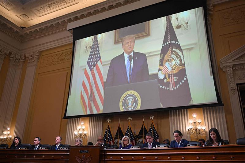 Former US President Donald Trump is seen on a screen during the last House Select Committee hearing 