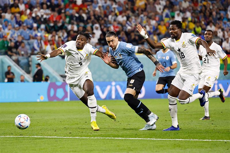 Ghana s defender #04 Mohammed Salisu vies with Uruguay s forward #11 Darwin Nunez during the Qatar 2