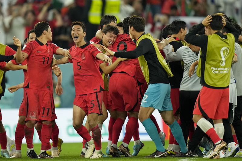 South Korea players celebrate after the World Cup group H soccer match between South Korea and Portu