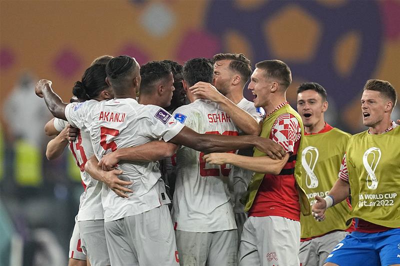 Switzerland players react at the end of the World Cup group G soccer match between Serbia and Switze