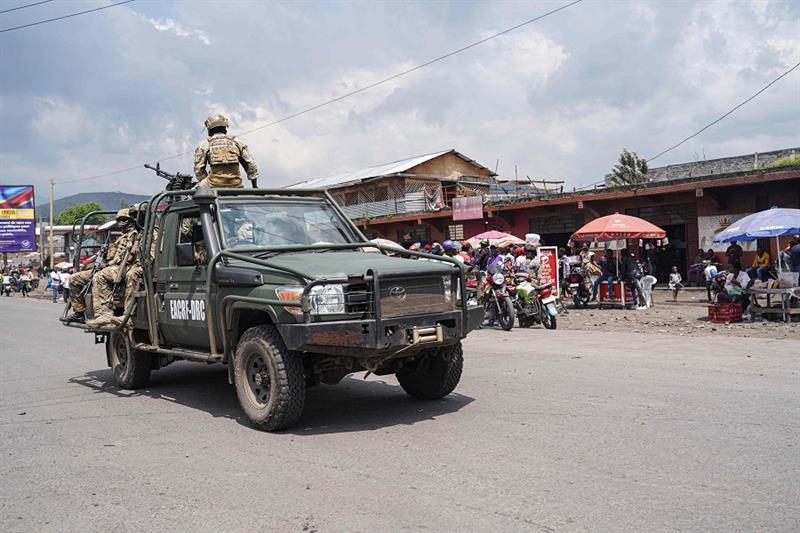 East African Community (EAC) force soldiers drive on a vehicle in Goma, eastern Democratic Republic 