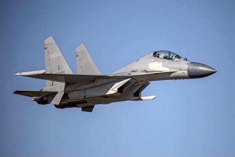 A Chinese PLA J-16 fighter jet flies in an undisclosed location.