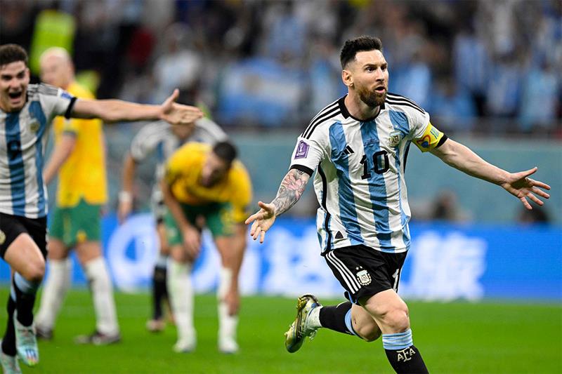 Argentina s forward #10 Lionel Messi (R) celebrates after he scored his team s first goal during the