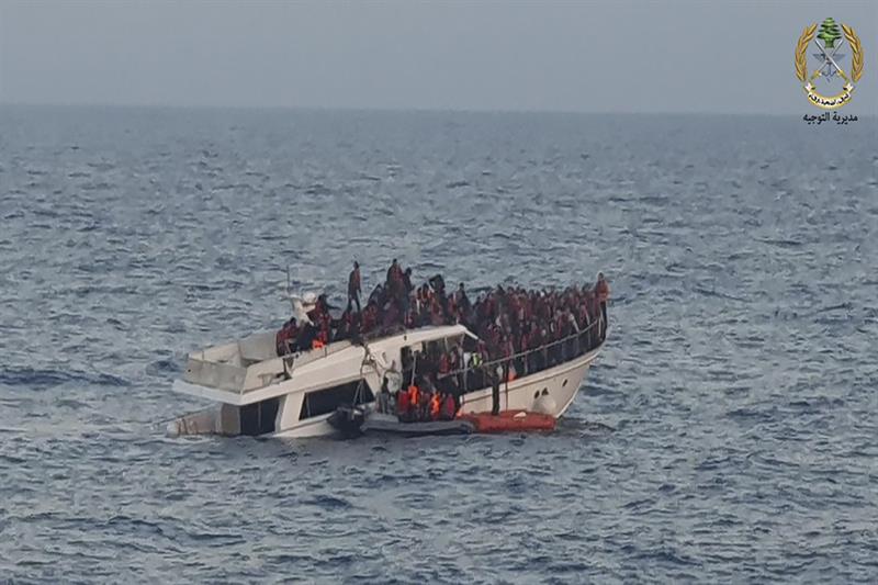 Lebanese army on their dinghy, rescuing migrants from a boat sinking in the Mediterranean Sea, near 