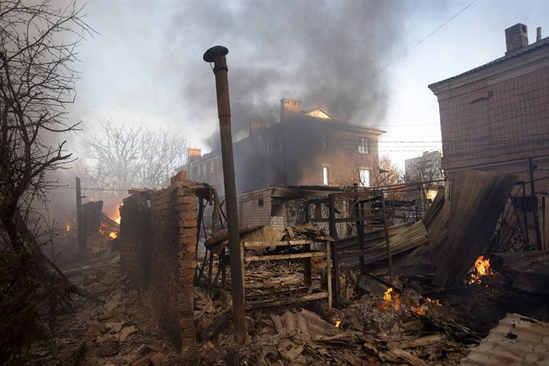 A building burns after shelling in Bakhmut, Donetsk region