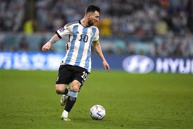 Argentina s Lionel Messi dribbles the ball during the World Cup round of 16 soccer match between Arg