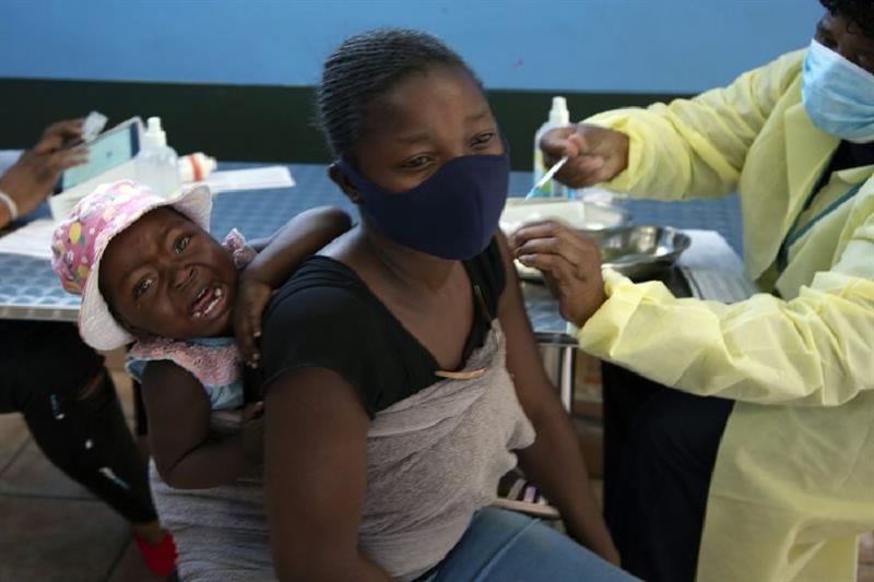 A woman receives Covid-19 vaccine in South Africa