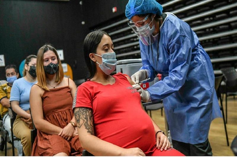 Pregnant woman at a vaccination center in Colombia