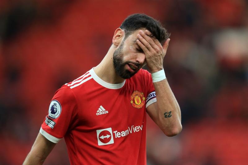 Manchester United s Portuguese midfielder Bruno Fernandes reacts after the final whistle of the Engl