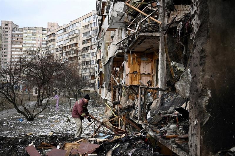  Debris at a damaged residential building in Kyiv