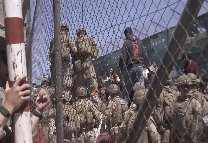 This image from a video released by the Department of Defense shows U.S. Marines at Abbey Gate befor