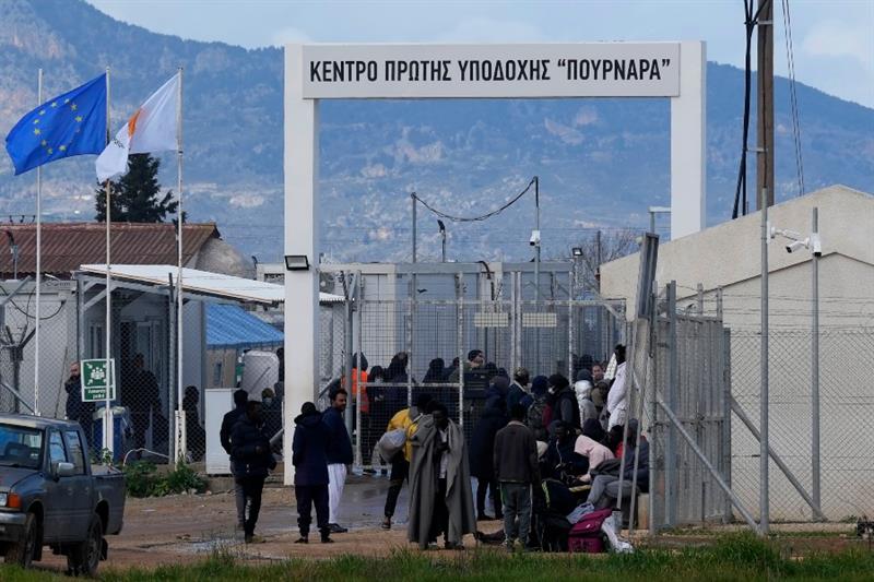 Migrants stand outside of Pournara center in Cyprus
