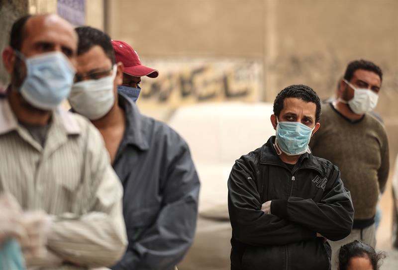 Egyptians wearing face masks  AFP  