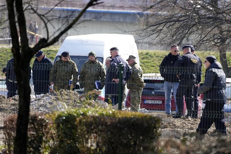 Police inspect the site of a drone crash in Zagreb, Croatia