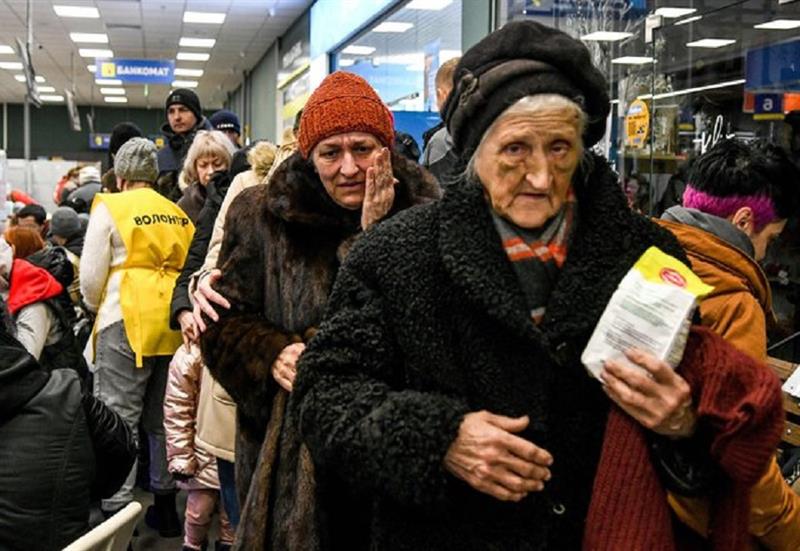 Elderly women who fled the besieged port city of Mariupol are pictured while the evacuees arrived to
