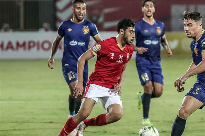 Ahly s midfielder Akram Tawfik (C) dribbles the ball during the second leg of the CAF champions leag