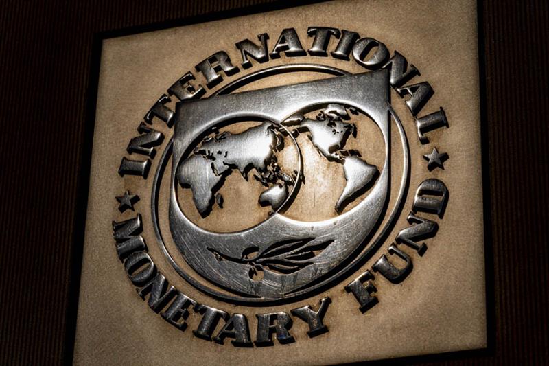 The logo of the International Monetary Fund is visible on their building, April 5, 2021, AP