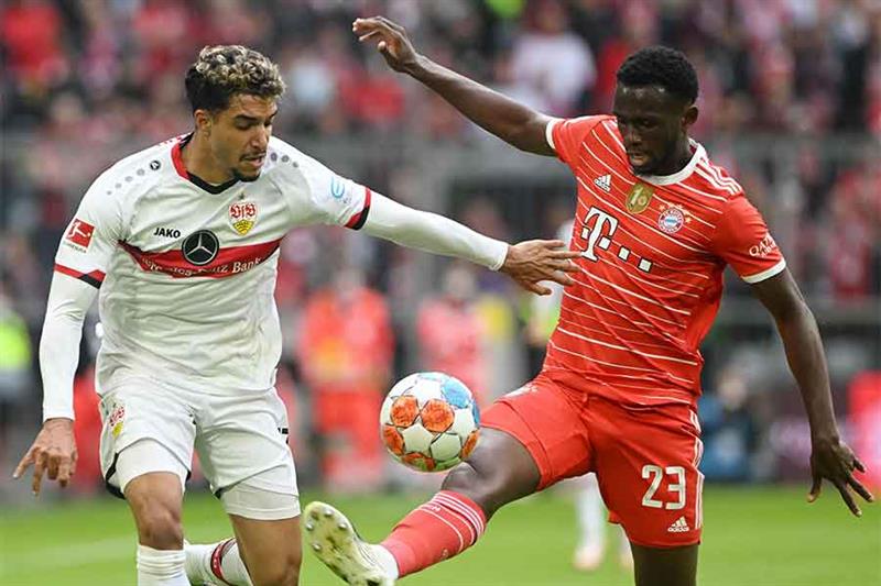Stuttgart s Egypt striker Omar Marmoush (L) and Bayern Munich s French defender Tanguy Nianzou vie f