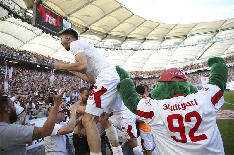 Stuttgart s Atakan Karazor celebrates with supporters after the German Bundesliga soccer match betwe