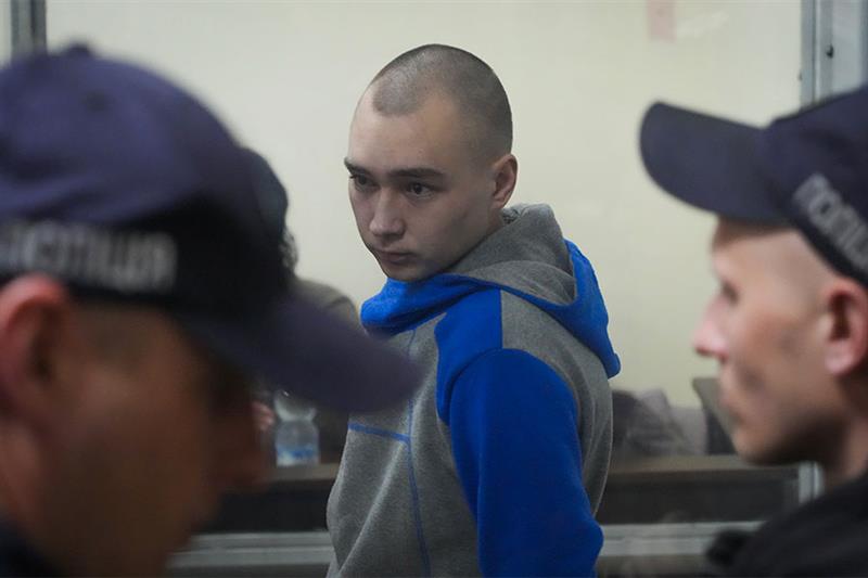Russian army Sergeant Vadim Shishimarin, 21, is seen behind a glass during a court hearing in Kyiv, 