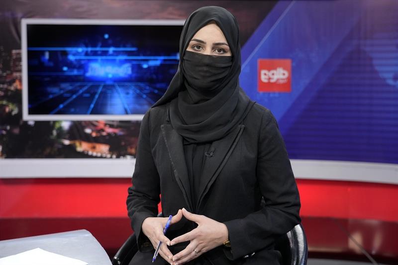 TV anchor Khatereh Ahmadi wears a face covering