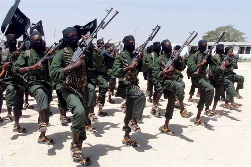 FILE - Hundreds of newly trained al-Shabab fighters perform military exercises in the Lafofe area so