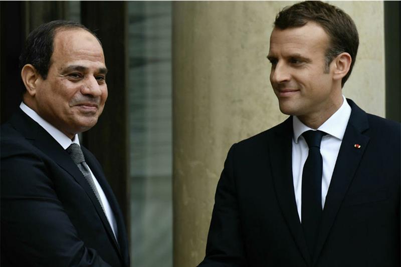 File photo of French President Emmanuel Macron welcoming Egypt s President Abdel Fattah al-Sisi at t