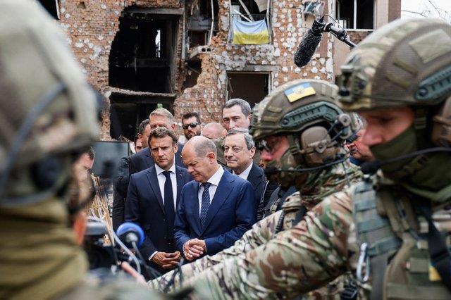 (From C) French President Emmanuel Macron gestures as he visits Irpin with Italian Prime Minister Ma