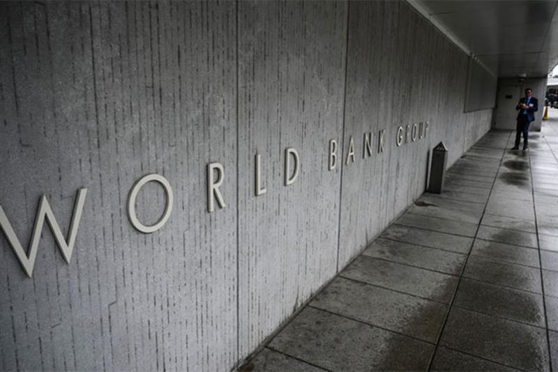 A person walks by the building of the Washington-based global development lender, The World Bank Gro