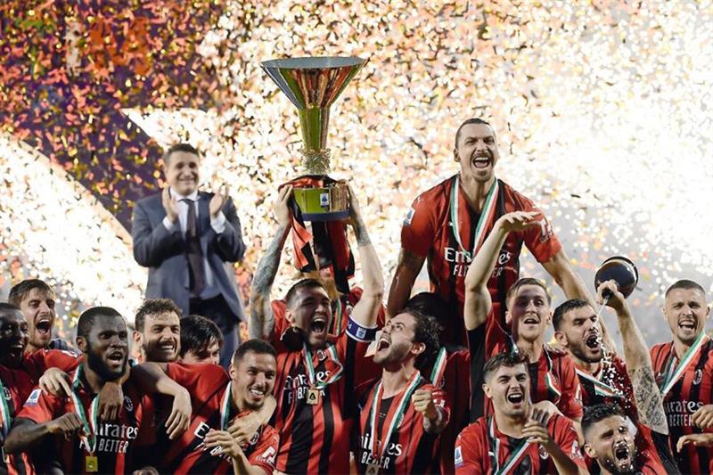 AC Milan celebrate with the Serie A trophy. AFP