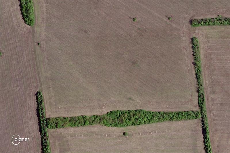 Farmers tilling fields near Slovyansk, Ukraine