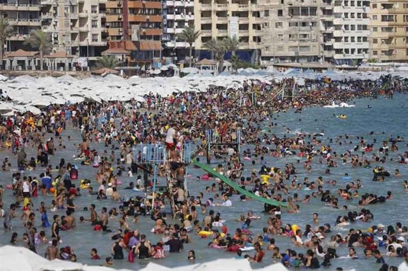 File photo: Egyptians crowd a public beach during a hot day in the Mediterranean city of Alexandria,