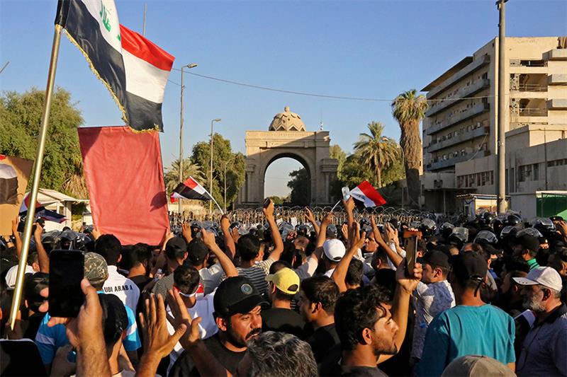 Supporters of Iraqi Shiite cleric Muqtada al-Sadr gather outside the main gate of Baghdad s Green Zo