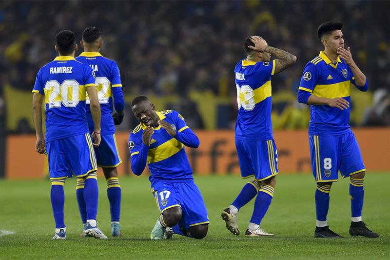 Argentina s Boca Juniors players react in a the penalty shootout during a Copa Libertadores round of