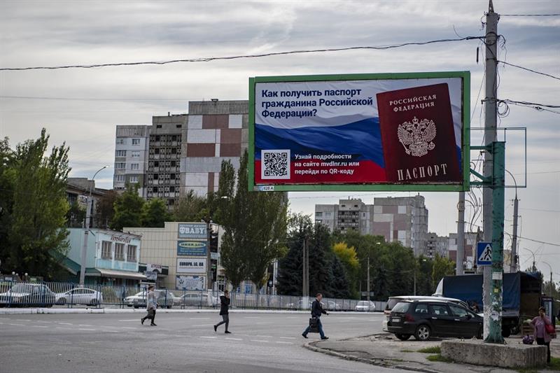 A billboard reading  How to get a passport of a citizen of Russia 