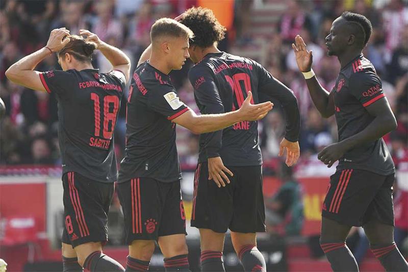 Bayern s Joshua Kimmich, centre, celebrates