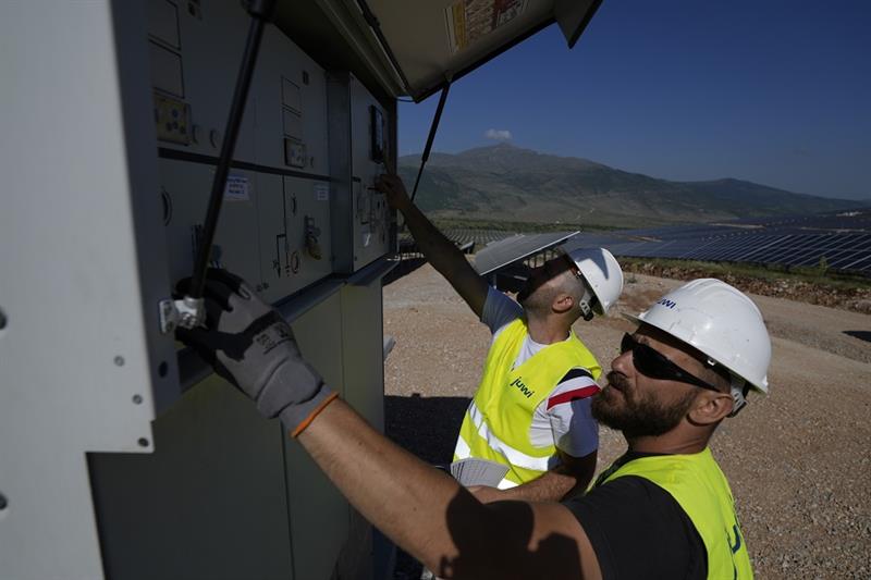 Maintenance engineers check installations at a new solar park