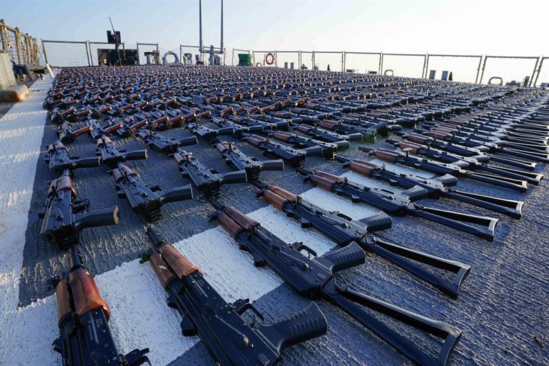 Thousands of AK-47 assault rifles on the flight deck of guided-missile destroyer USS The Sullivans d