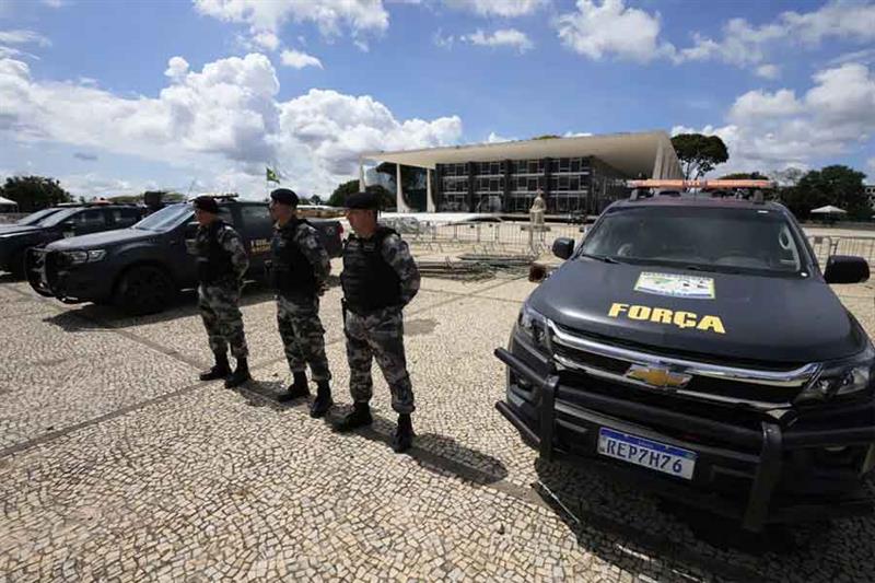 Military police stand guard outside the Supreme Court in Brasilia, Brazil, Wednesday, Jan. 11, 2023,