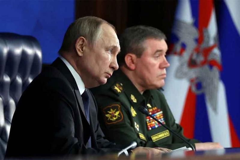 Moscow s army chief of staff Valery Gerasimov, pictured here with President Vladimir Putin in Decemb