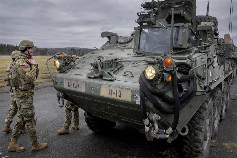 Soldiers of the 2nd Cavalry Regiment stand next to a Stryker combat vehicle in Vilseck, Germany