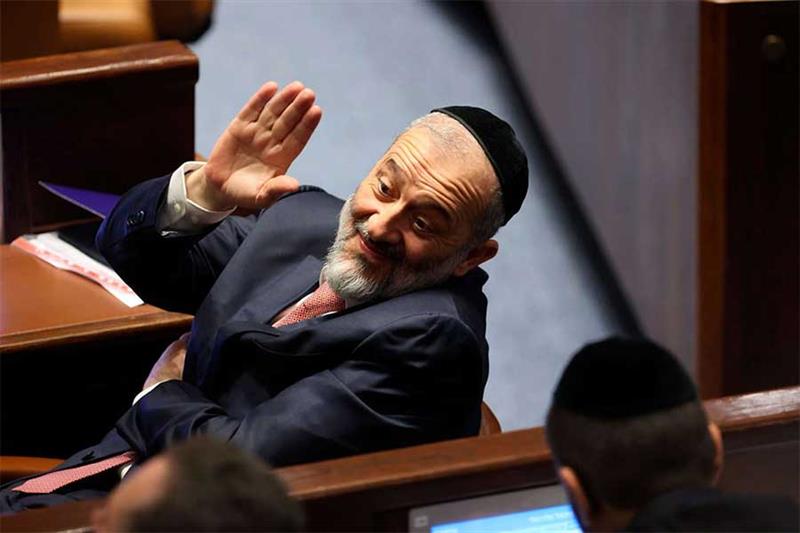 Member of Knesset Aryeh Deri waves during the swearing-in ceremony for Israeli lawmakers at the Knes