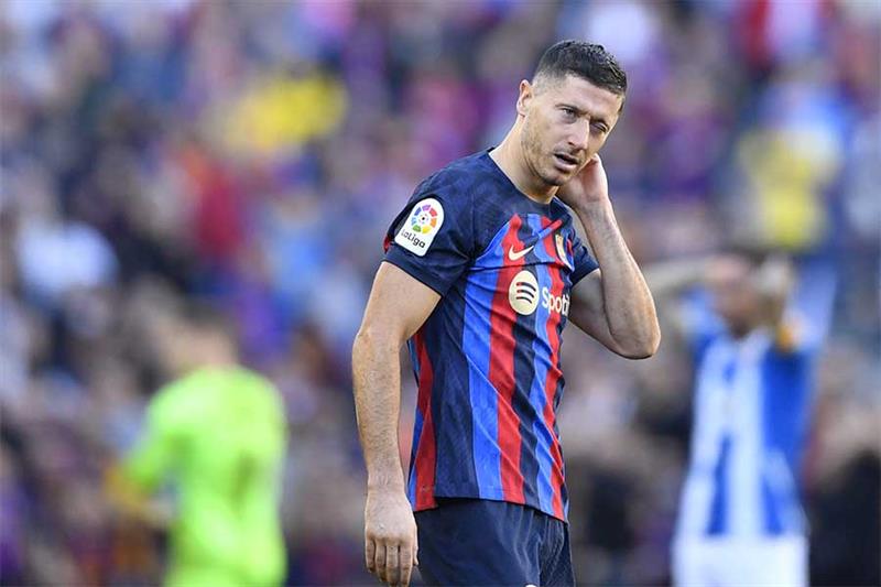 Barcelona s Polish forward Robert Lewandowski reacts during the Spanish League football match betwee