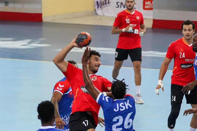 Egyptian handballer  trying to score among JSK players