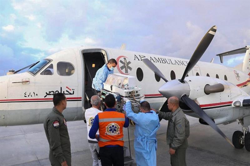 Medics transporting a premature Palestinian baby evacuated from Gaza into an Air Ambulance at Egypt 