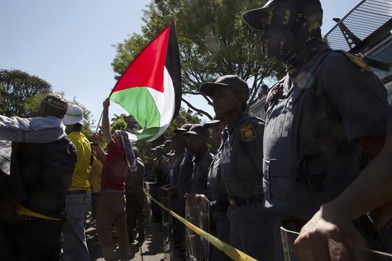 Pro-Palestinian supporters demonstrate at the entrance to the Israeli embassy in Pretoria, South Afr