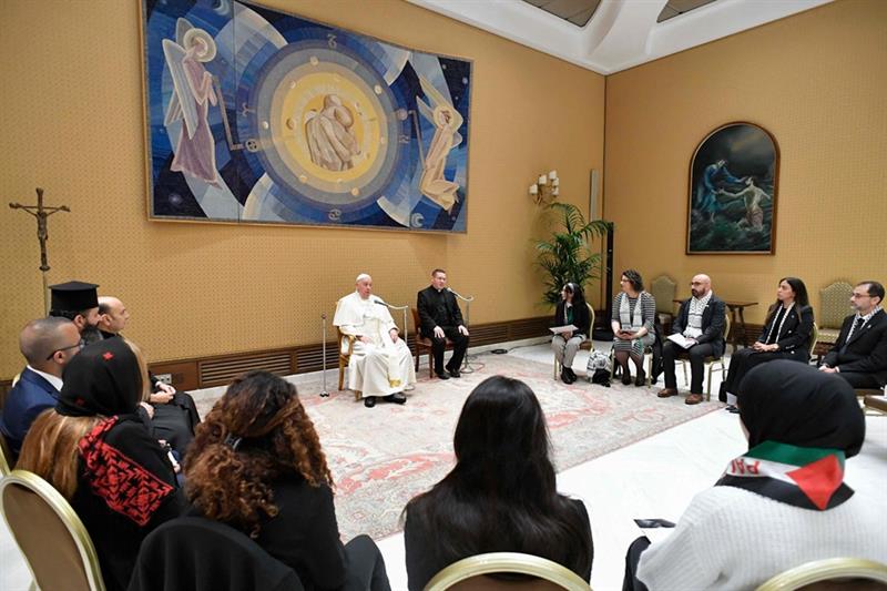 Pope Francis (C) met with family members of Palestinians who are currently living through the war in