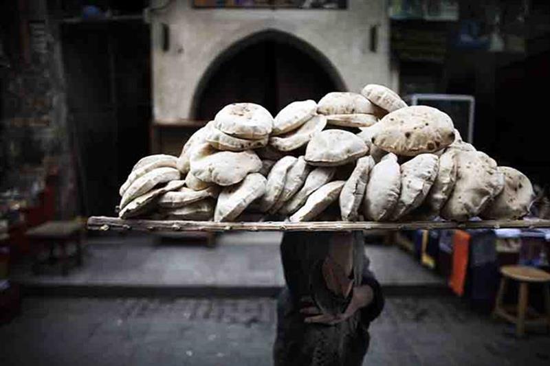 A file photo of bread vendor in Cairo. Photo by AFP