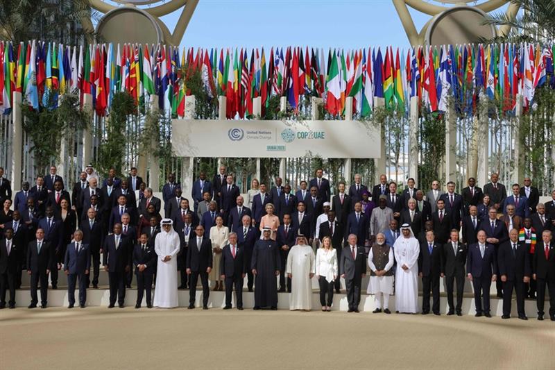 Participating world leaders and delegates pose for a family photo during the COP28 United Nations cl